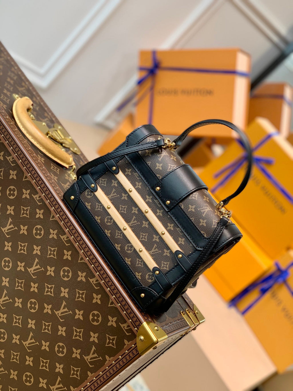 TRIANON PM 21 IN BROWN MONOGRAM COATED CANVAS AND BLACK CALFSKIN SIGNATURE S-LOCK