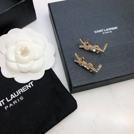 YSL 26S BAGUETTE CRYSTAL LOGO DROP EARRINGS IN GOLD TONE METAL 629136