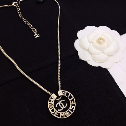 CHANEL 26S CHANEL CC LOGO MADEMOISELLE ROUND NECKLACE IN GOLD METAL 633322