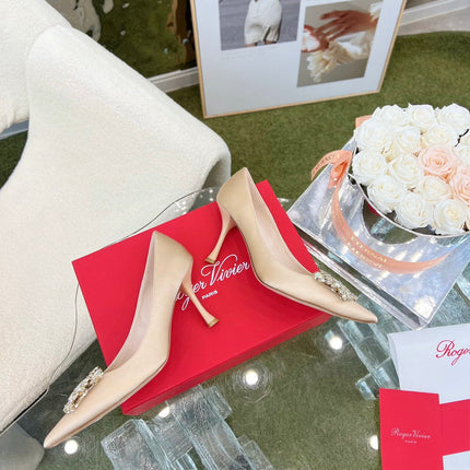 EFFLORESCENCE POINTED-TOE PUMPS IN NUDE SATIN WITH CRYSTAL BUCKLE