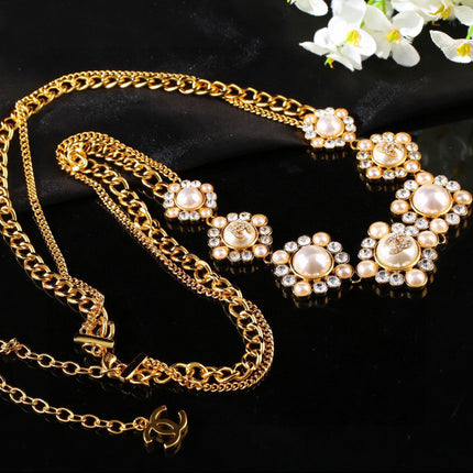 CHANEL 25S CHAIN BELT IN GOLD METALLIC WITH PEARL 614283