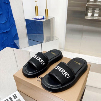 BURBERRY 26S SLIDE SANDALS IN BLACK CALFSKIN AND FABRIC