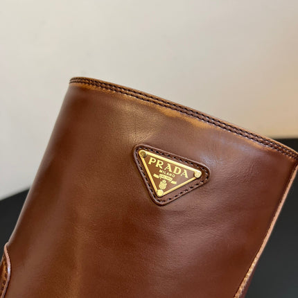 PRADA 25S PLATFORM ANKLE BOOTS IN BROWN CALFSKIN WITH GOLD HARDWARE