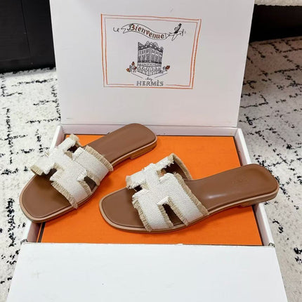 HERMES 26S ORAN FRINGED SLIDE SANDALS IN ECRU CANVAS