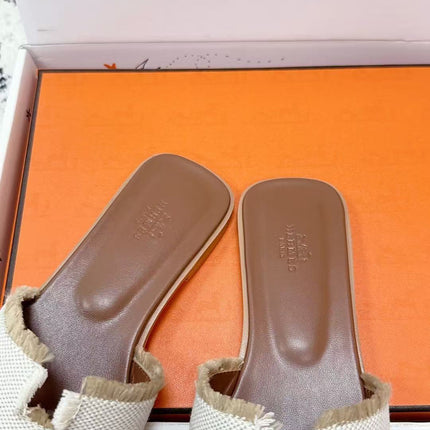 HERMES 26S ORAN FRINGED SLIDE SANDALS IN ECRU CANVAS