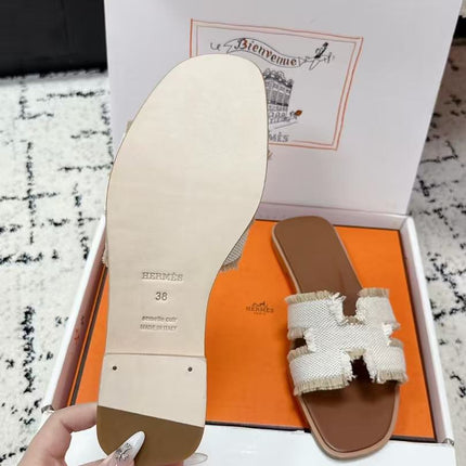 HERMES 26S ORAN FRINGED SLIDE SANDALS IN ECRU CANVAS