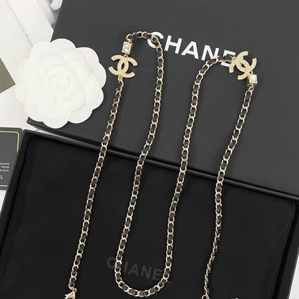 GOLD-TONE CHANEL CHAIN BELT WITH BLACK ENAMEL AND CRYSTAL-ENCRUSTED INTERLOCKING CC CHARMS
