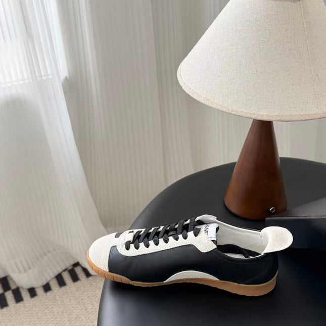 CHANEL TRAINERS IN BLACK AND WHITE CALFSKIN AND EMBOSSED SUEDE CALFSKIN