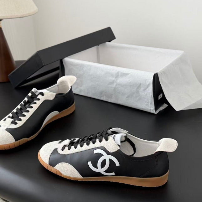 CHANEL TRAINERS IN BLACK AND WHITE CALFSKIN AND EMBOSSED SUEDE CALFSKIN