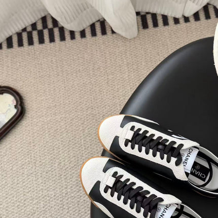 CHANEL TRAINERS IN BLACK AND WHITE CALFSKIN AND EMBOSSED SUEDE CALFSKIN
