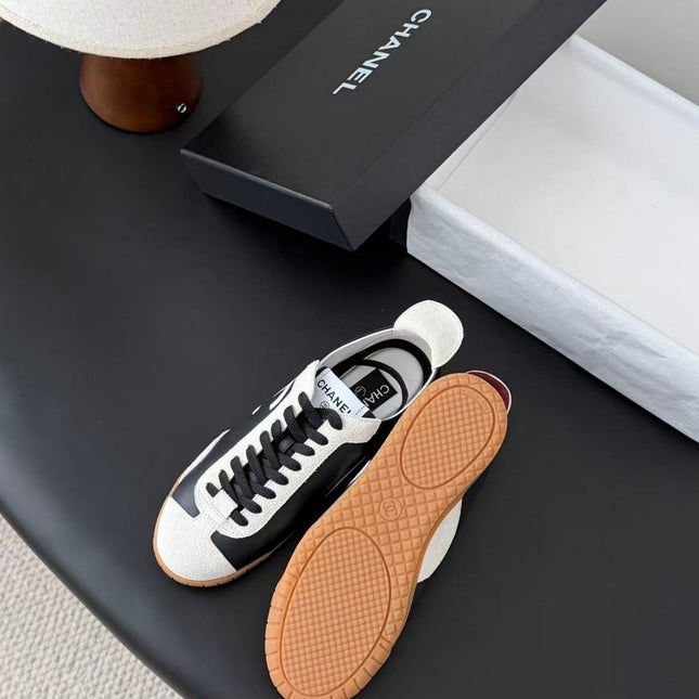 CHANEL TRAINERS IN BLACK AND WHITE CALFSKIN AND EMBOSSED SUEDE CALFSKIN