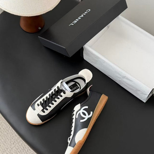 CHANEL TRAINERS IN BLACK AND WHITE CALFSKIN AND EMBOSSED SUEDE CALFSKIN