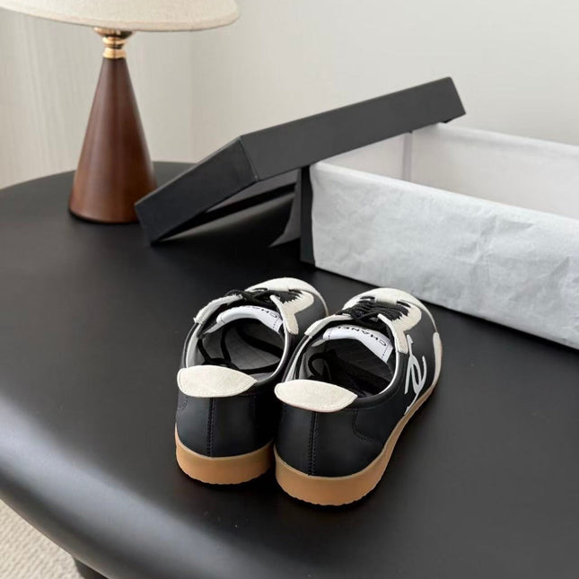 CHANEL TRAINERS IN BLACK AND WHITE CALFSKIN AND EMBOSSED SUEDE CALFSKIN