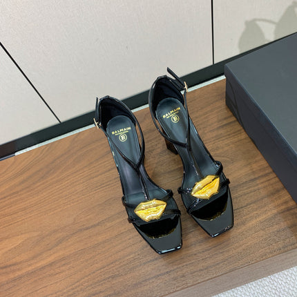 BALMAIN 26S LIP-EMBELLISHED HEELS 105 MM IN BLACK CALFSKIN WITH GOLD HARDWARE