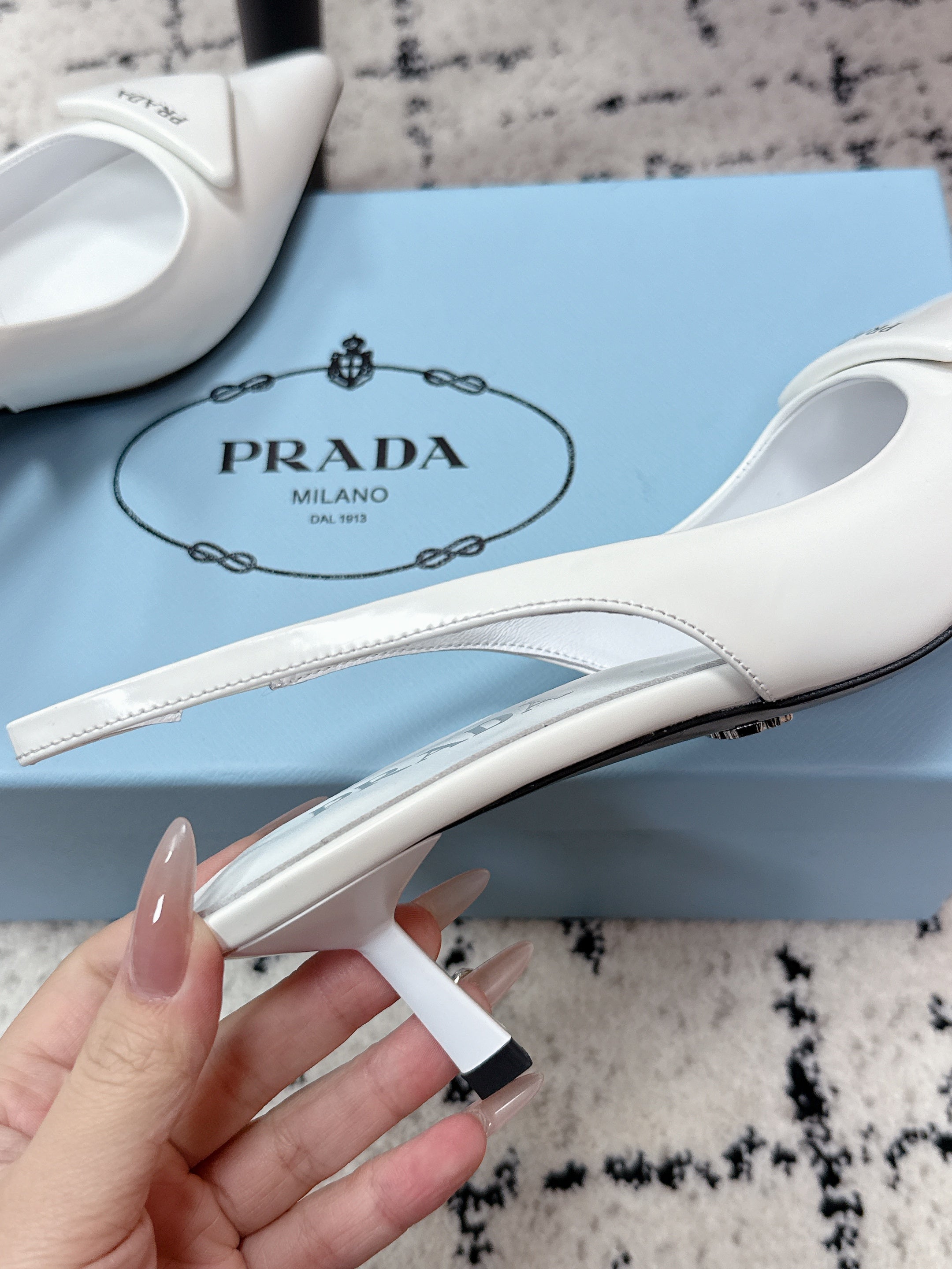PRADA 26S SLINGBACK PUMPS 60MM IN WHITE PATENT CALFSKIN