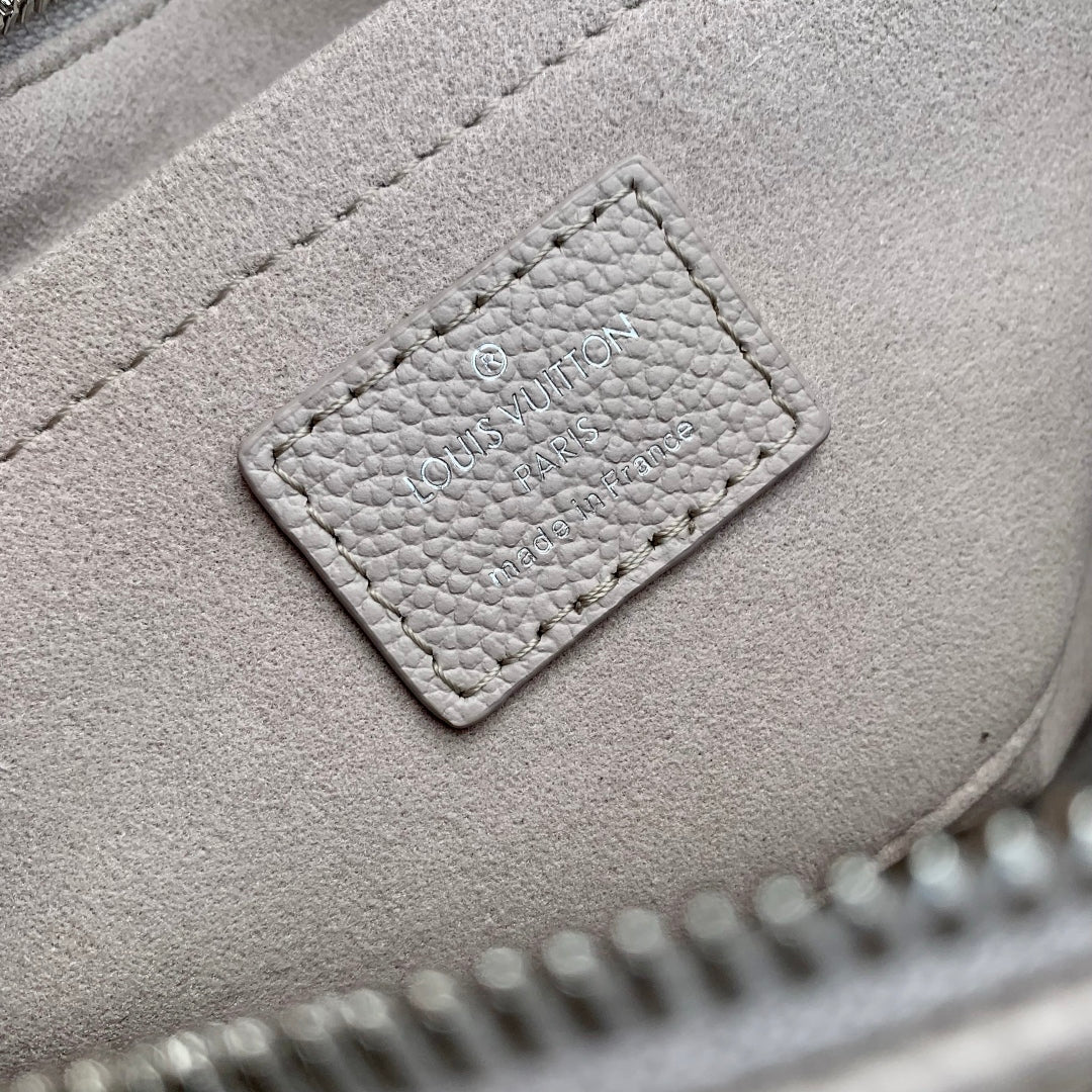 ONTHEGO EAST WEST BAG 25 IN BICOLOR MONOGRAM EMPREINTE LEATHER