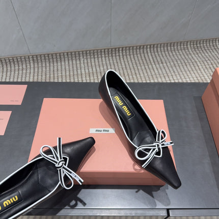 MIUMIU 26S POINTED TOE PUMPS 55MM IN BLACK AND WHITE CALFSKIN WITH BOW