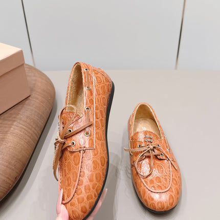 MIUMIU 26S BOAT SHOES IN ORANGE BROWN EMBOSSED CALFSKIN