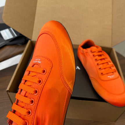 PRADA 25S SNEAKER IN ORANGE SILK