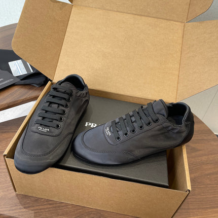 PRADA 25S SNEAKER IN BLACK SILK
