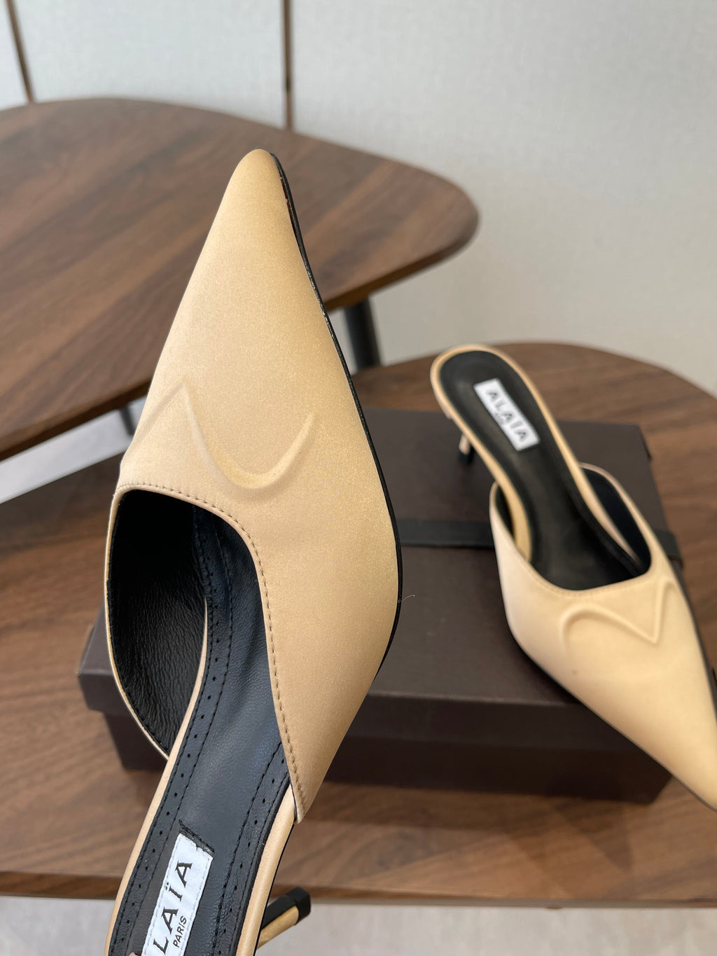 ALAIA 26S HEELED MULES 50 MM IN WARM BEIGE FABRIC