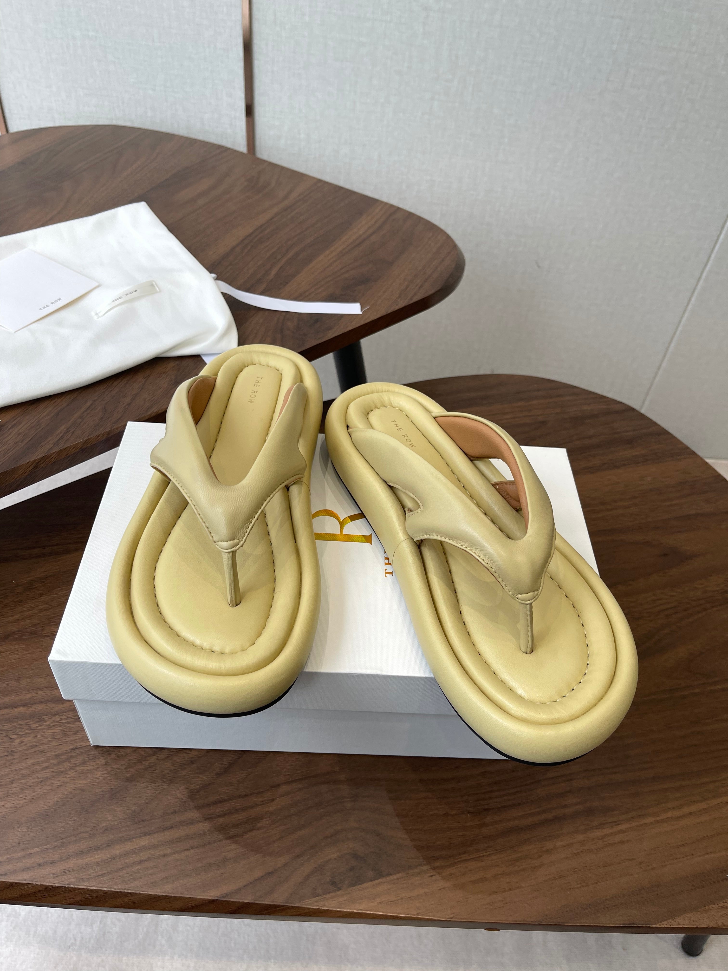 THE ROW 26S PUFFED THONG SANDALS IN BUTTER YELLOW CALFSKIN