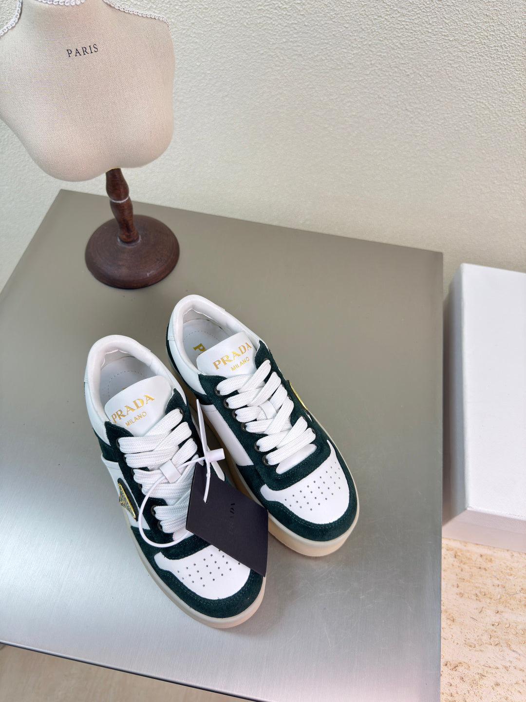 PRADA 26S DOWNTOWN THICK SOLE SNEAKERS IN WHITE CALFSKIN AND BLACK SUEDE
