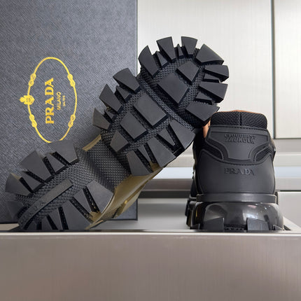 PRADA 26S CLOUDBUST THUNDER SNEAKERS 60MM IN BLACK AND GOLD MESH FABRIC AND TPU