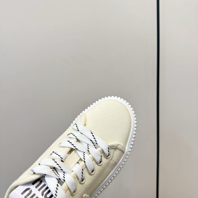 MIUMIU 26S SNEAKER MULES IN LIGHT YELLOW CANVAS