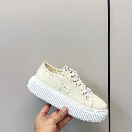 MIUMIU 26S PLATFORM SNEAKERS IN LIGHT YELLOW CANVAS