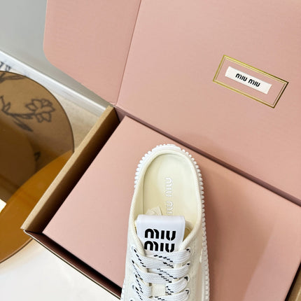MIUMIU 26S SNEAKER MULES IN LIGHT YELLOW CANVAS