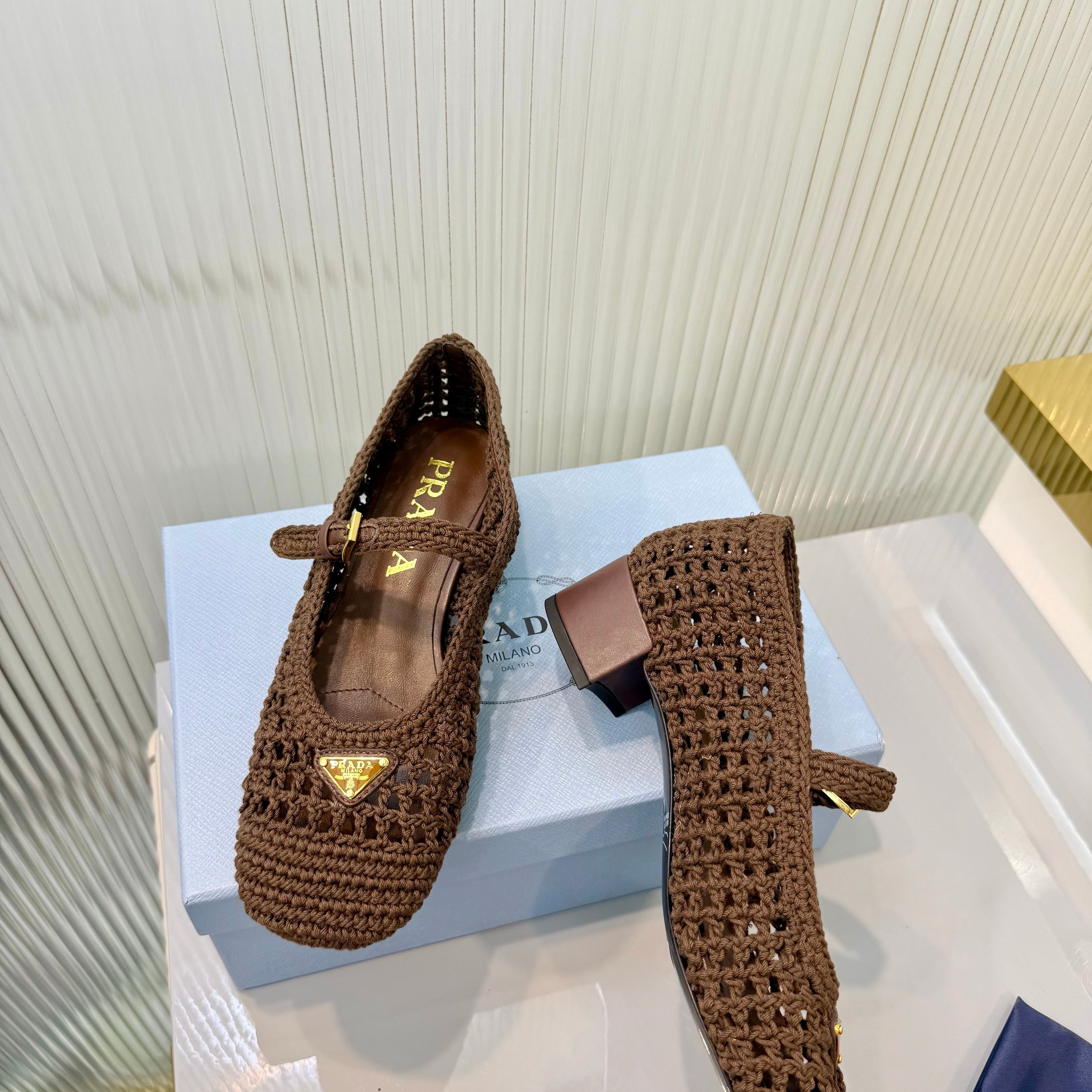 PRADA 26S LOGO PLAQUE CROCHET MARY JANE PUMPS 50MM IN DARK BROWN WOVEN FIBER