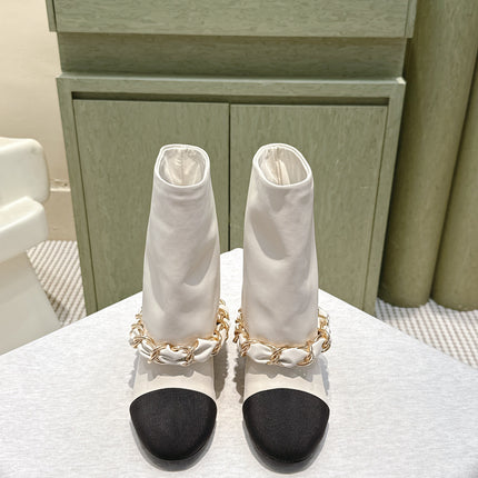 CHANEL 25S CALF-LENGTH BOOTS 45MM IN WHITE AND BLACK CALFSKIN GOLD HARDWARE