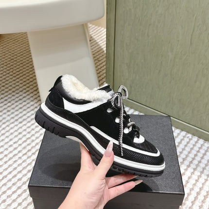 CHANEL 25S THICK-SOLE SNEAKERS IN BLACK AND WHITE CALFSKIN WITH FUR LINING