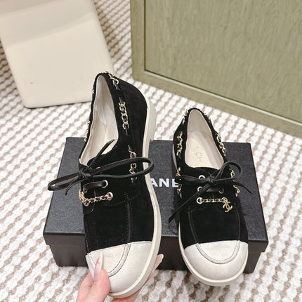 CHANEL 25S MOCCASINS IN BLACK AND LIGHT GREY SUEDE