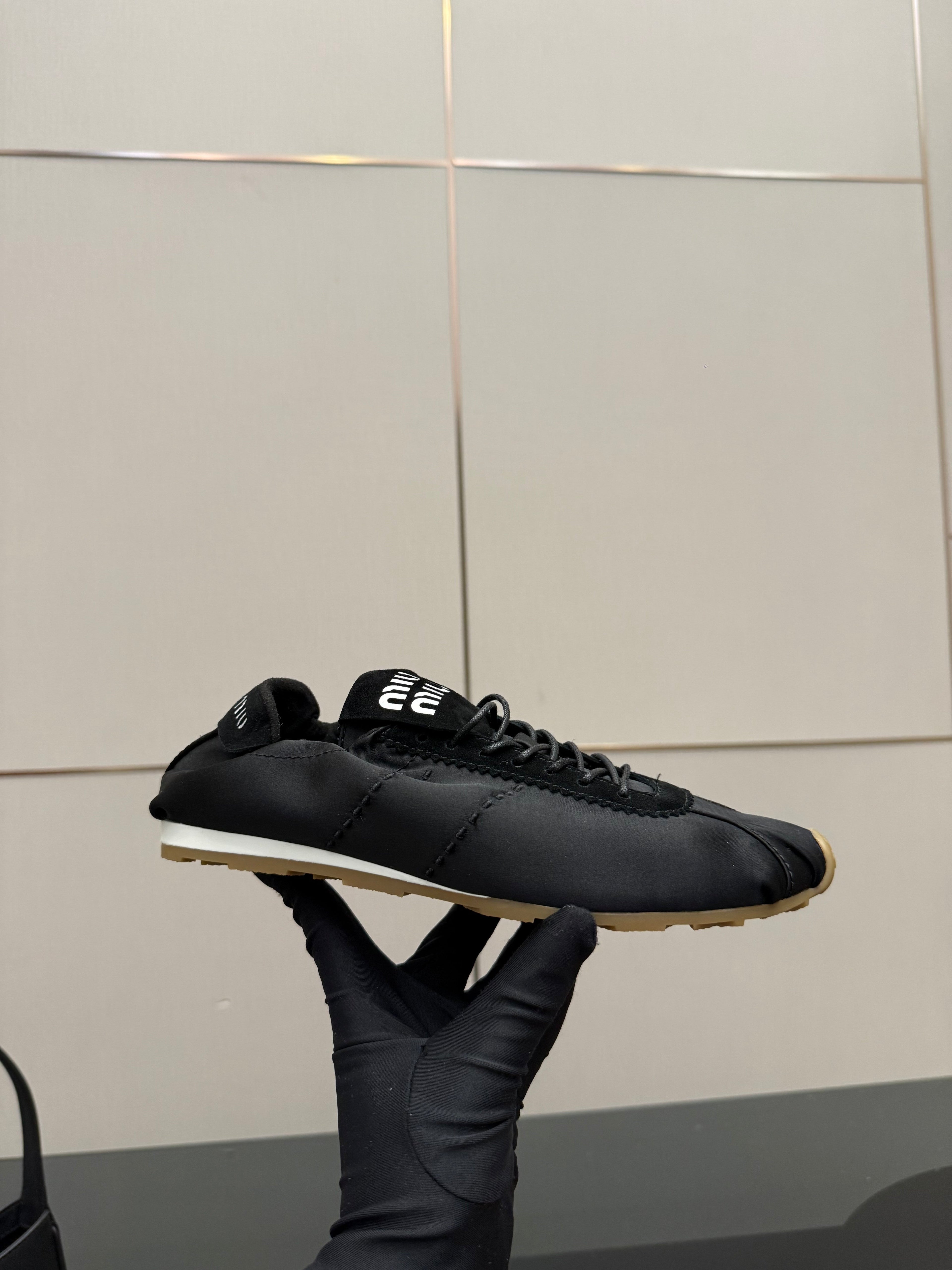 MIUMIU 25S SNEAKERS IN BLACK PLUME SATIN