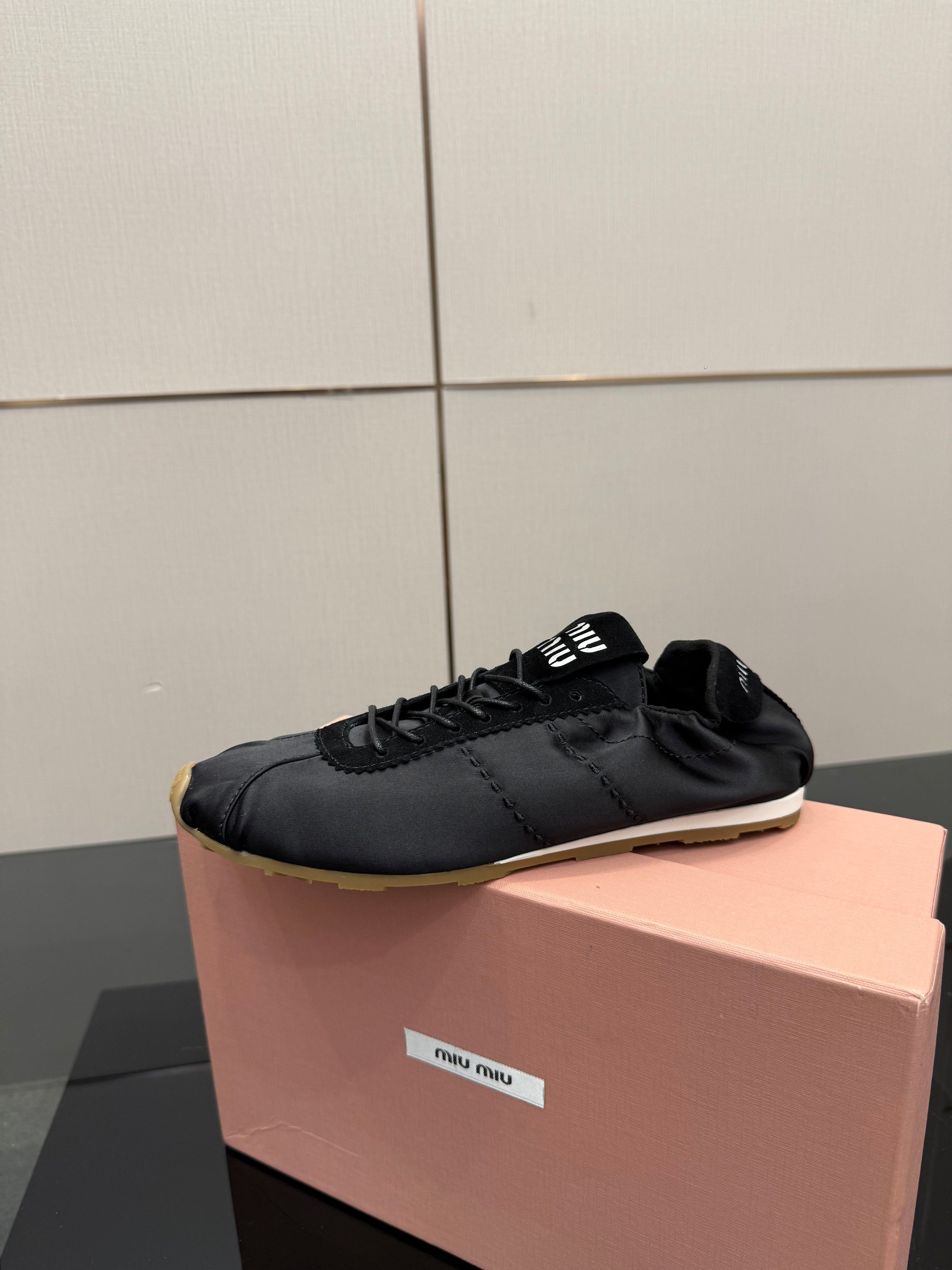 MIUMIU 25S SNEAKERS IN BLACK PLUME SATIN