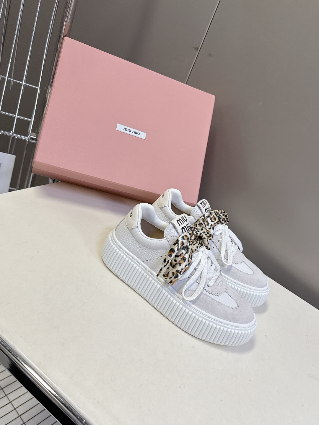MIUMIU 25S SNEAKERS 45NN IN WHITE SUEDE WITH LEOPARD-PRINT LACES