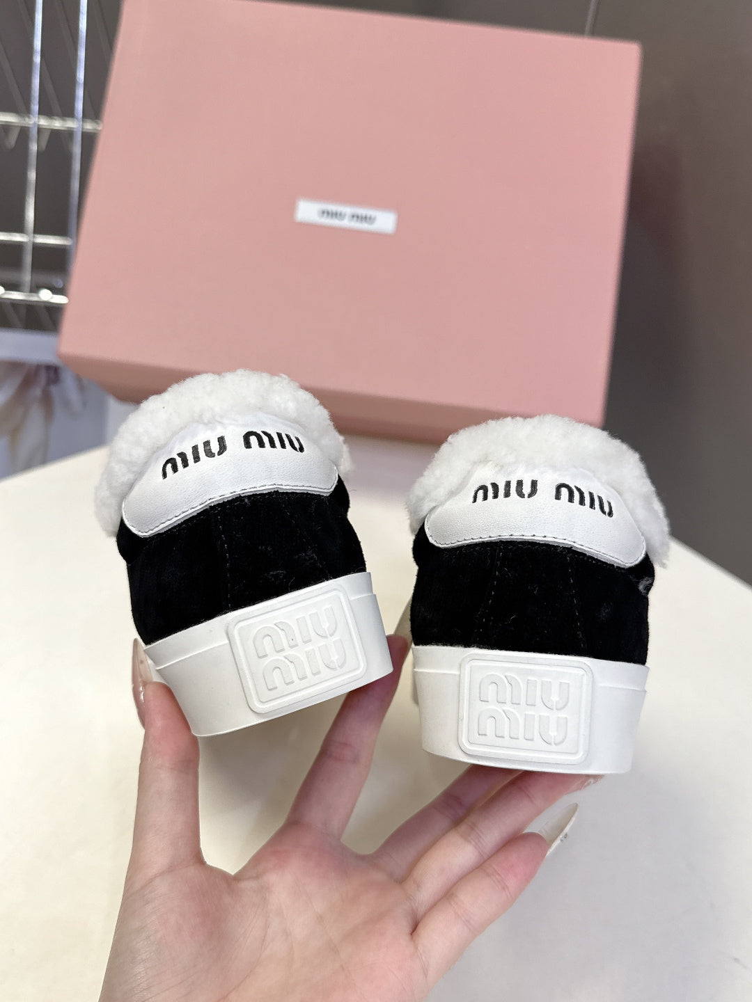 MIUMIU 25S SNEAKERS IN BLACK SUEDE WITH SHEARLING