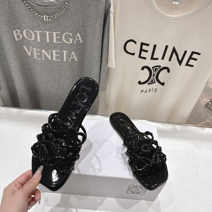 LOEWE 26S PETAL ANAGRAM SLIDE IN BLACK PATENT CALFSKIN