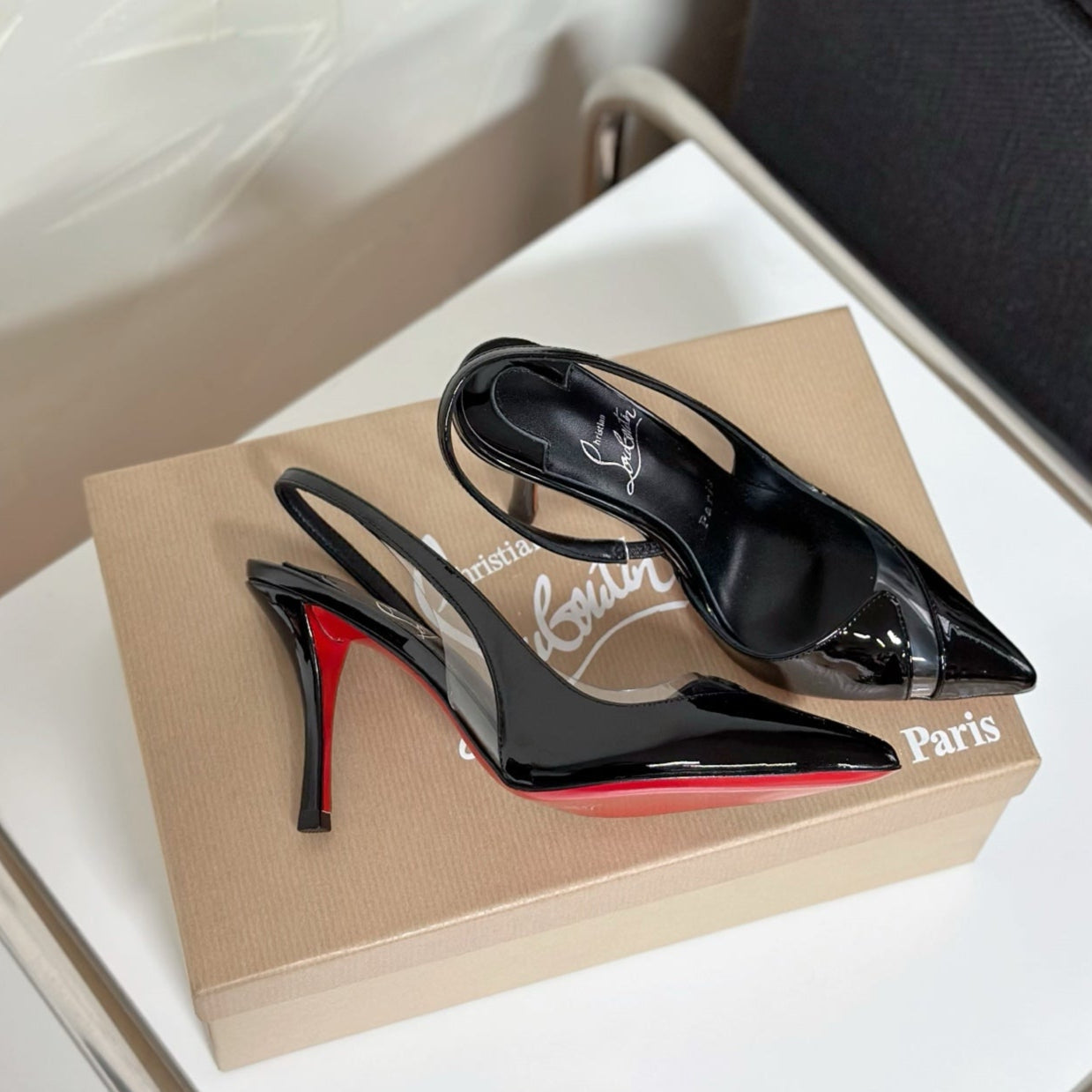 TRANSPARENT PANEL SLING BACK PUMPS IN BLACK PATENT CALFSKIN