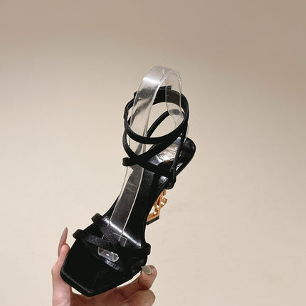 YSL 25S HIGH-HEEL SANDALS 100 MM IN BLACK SATIN WITH YSL LOGO HEEL DESIGN IN GOLD