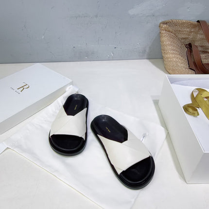 THE ROW 26S CROSS STRAP SLIDES IN IVORY WHITE CALFSKIN WITH BLACK FOOTBED