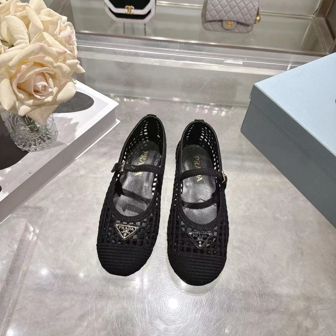 PRADA 26S LOGO PLAQUE MARY JANE FLATS IN BLACK WOVEN FIBER