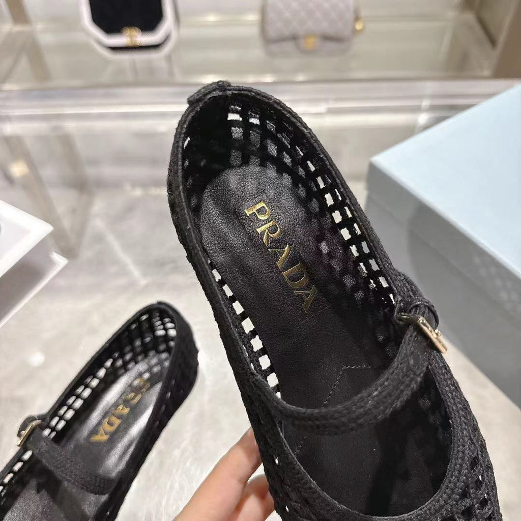 PRADA 26S LOGO PLAQUE MARY JANE FLATS IN BLACK WOVEN FIBER