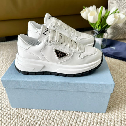 PRA THICK SOLE SNEAKER WHITE AND BLACK LOGO CALFSKIN