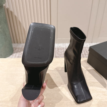 ALAIA 26S HEELED BOOTS 90 MM IN BLACK CALFSKIN