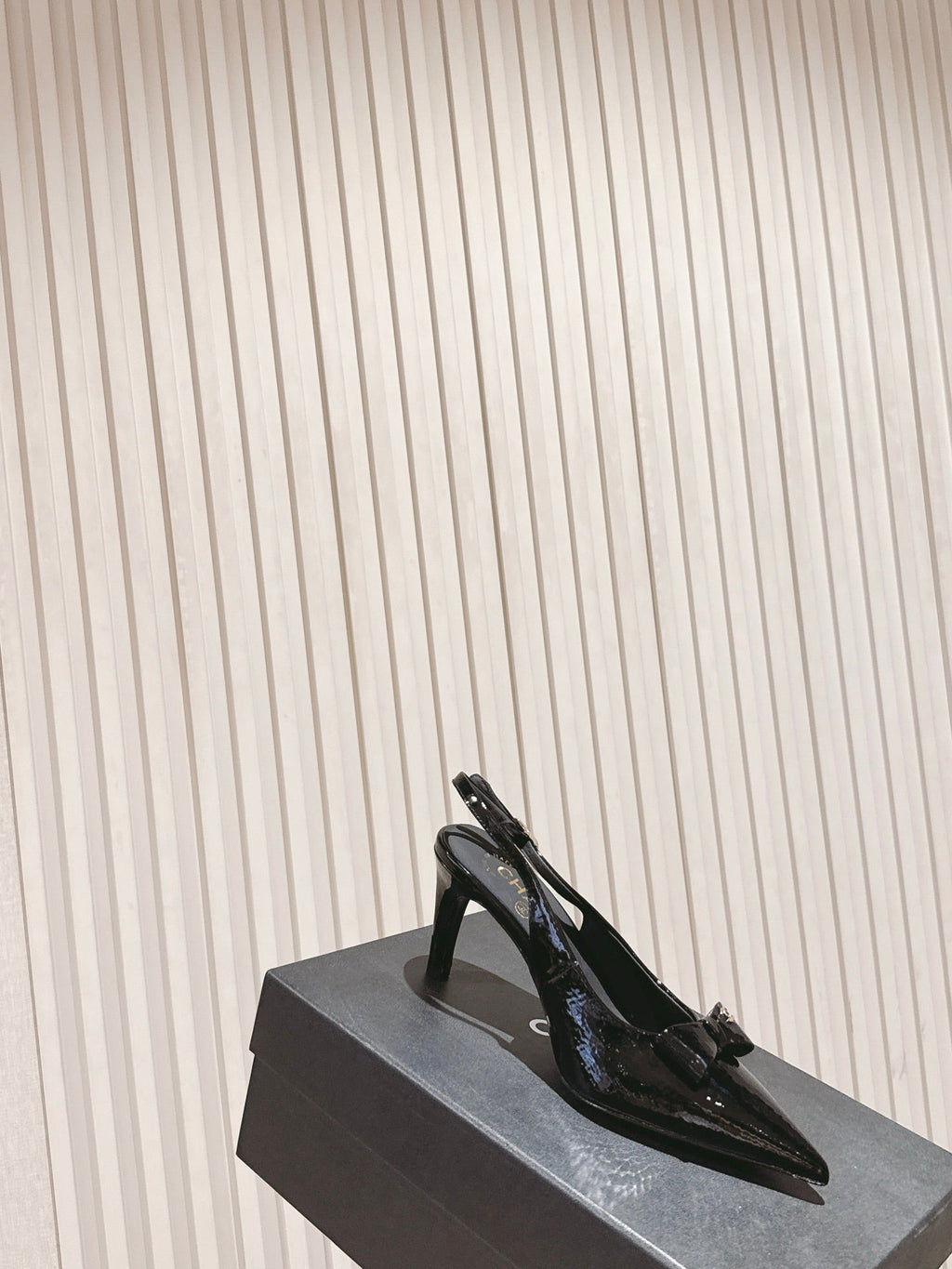 CC HIGH SLINGBACK IN BLACK LAMBSKIN WITH BOW ATTACHED
