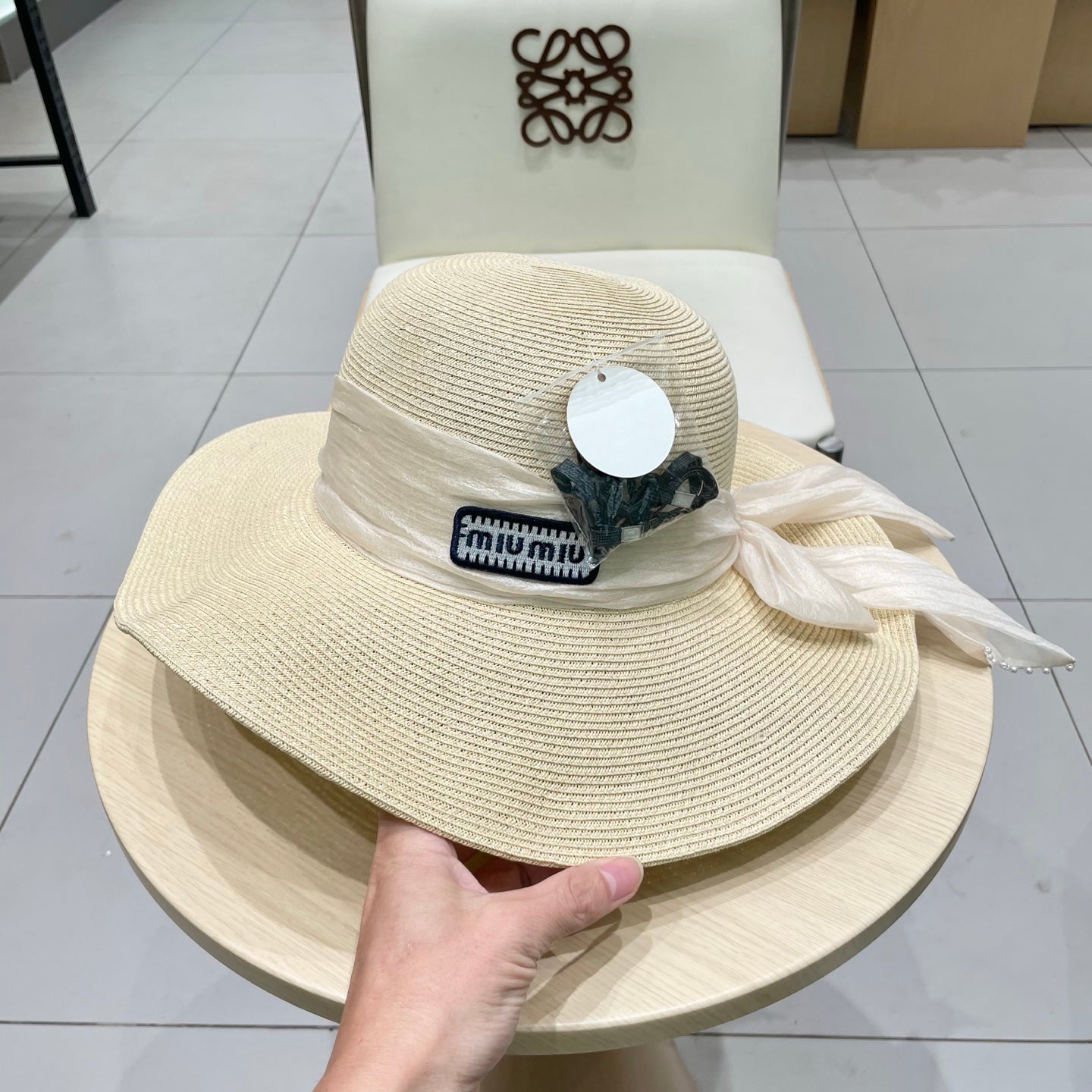 MIUMIU WIDE-BRIM BEACH HAT IN LIGHT BEIGE WITH FABRIC BOW