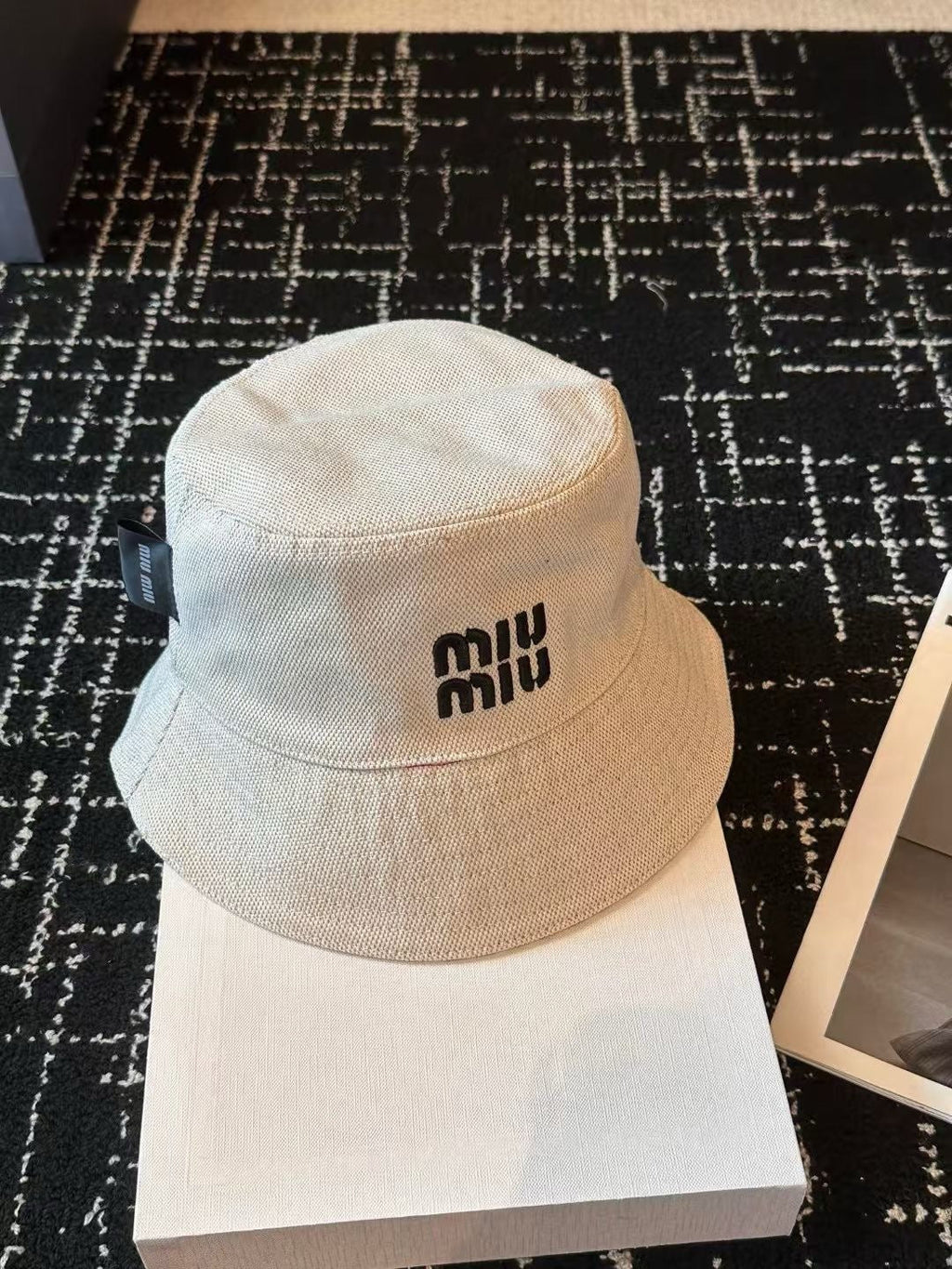 MIUMIU CLASSIC REVERSIBLE BUCKET HAT IN LIGHT BEIGE AND BLACK FABRIC